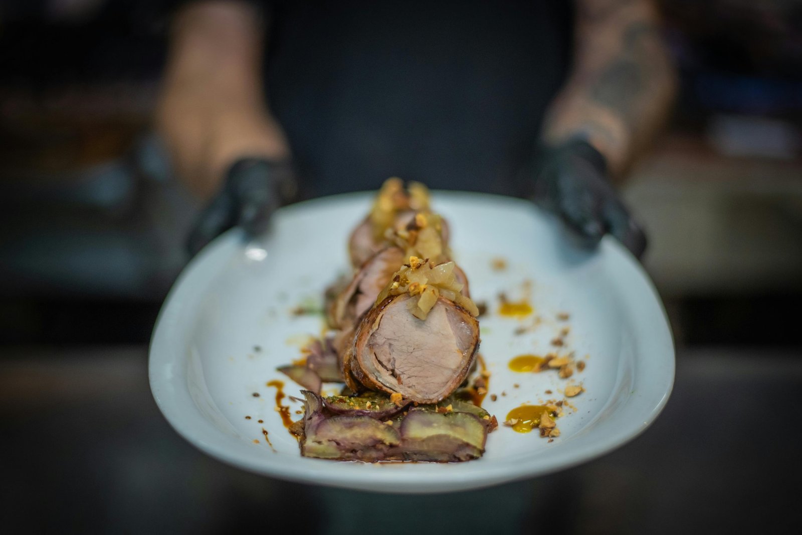 Expertly prepared gourmet pork dish, highlighting exquisite food presentation.